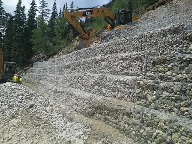 Pro-Flex gabions being installed on a steep slope in Rocky Mountains